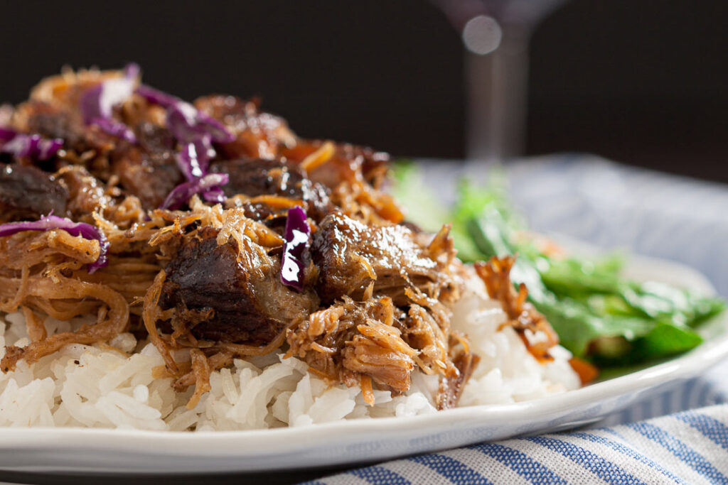 Kalua pork shredded over rice