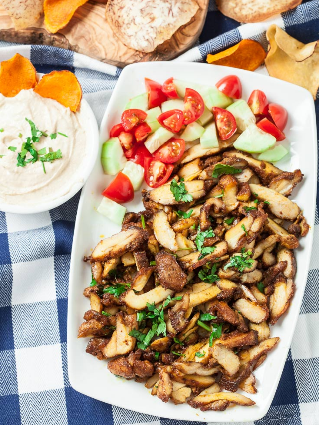 Chicken Shawarma on a plate with dressing and salad