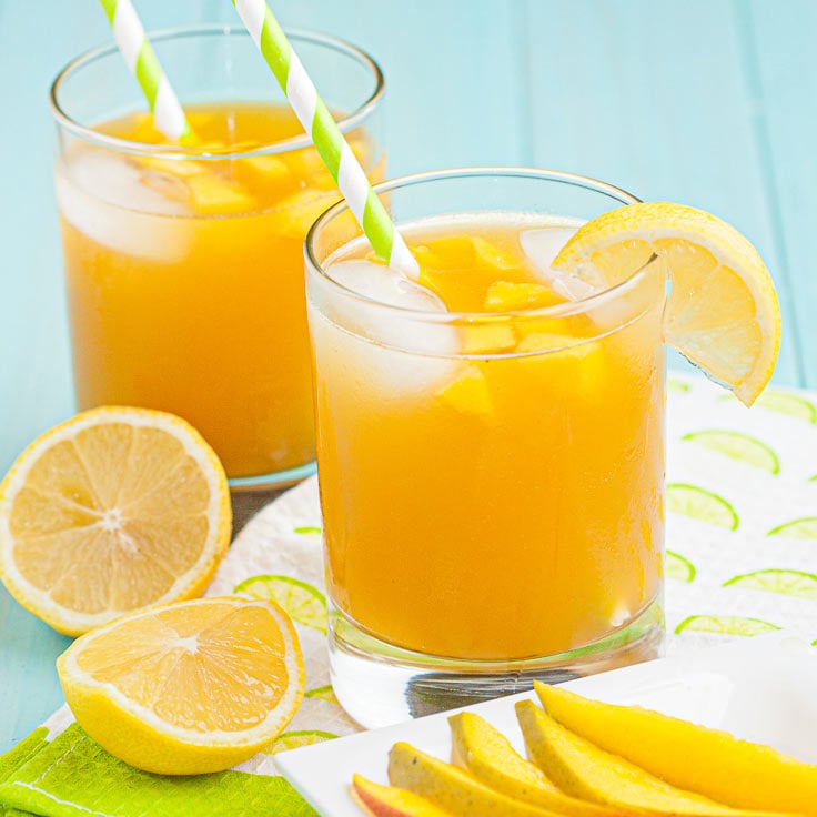 mango cocktails in glasses with ice