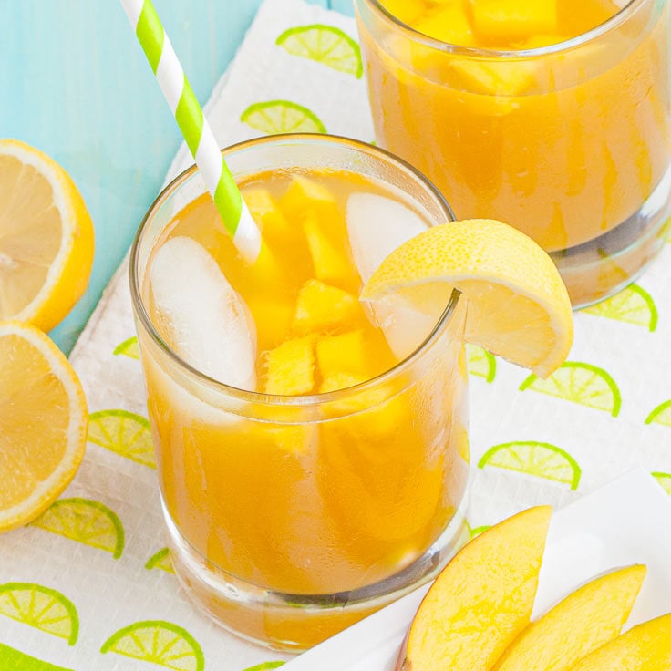 mango cocktails in glasses with ice