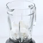Scooping the ice cream into the blender.