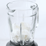 Scooping the ice cream into the blender.