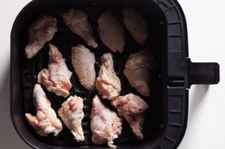 Air Fryer Chicken Wings uncooked in tray