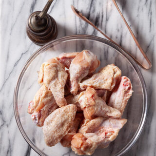 Air Fryer Chicken Wings seasoned in a bowl