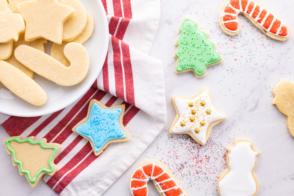 vanilla cut out cookies with icing and sprinkles