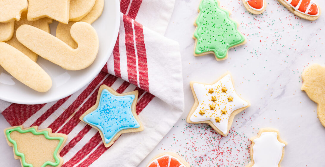 vanilla cut out cookies with icing and sprinkles