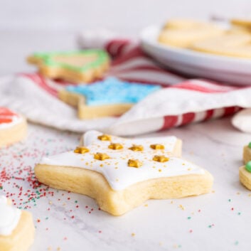 vanilla cut out cookies with icing and sprinkles