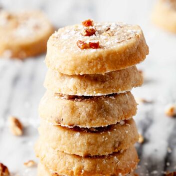 Pecan Sandies Shortbread Cookies piled on top of each other.