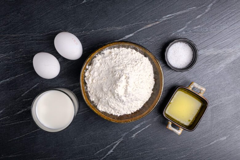 Popover ingredients on a black marble table.