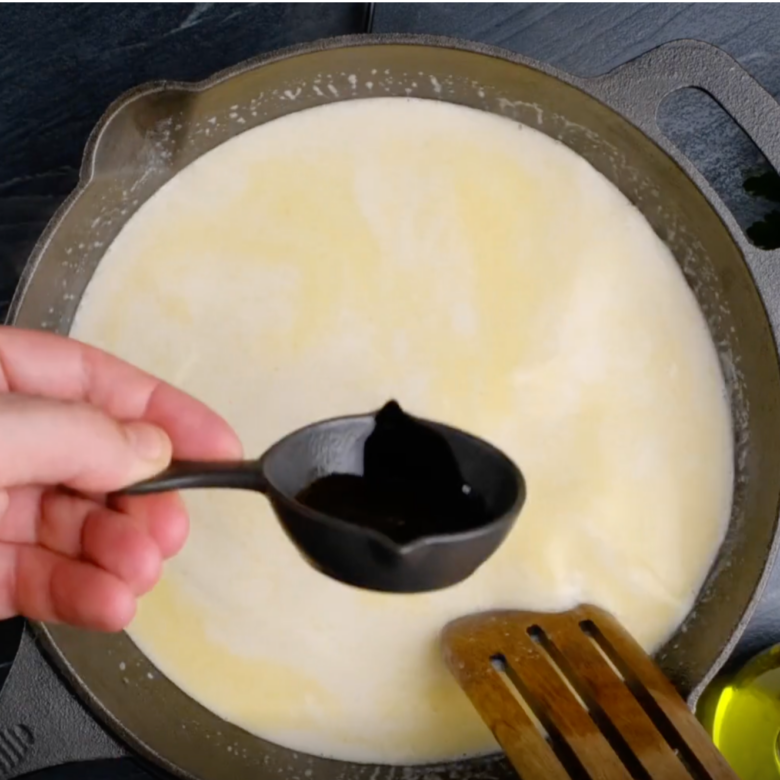 Overhead shot of Swedish meatball gravy mixture being cooked on the stovetop.