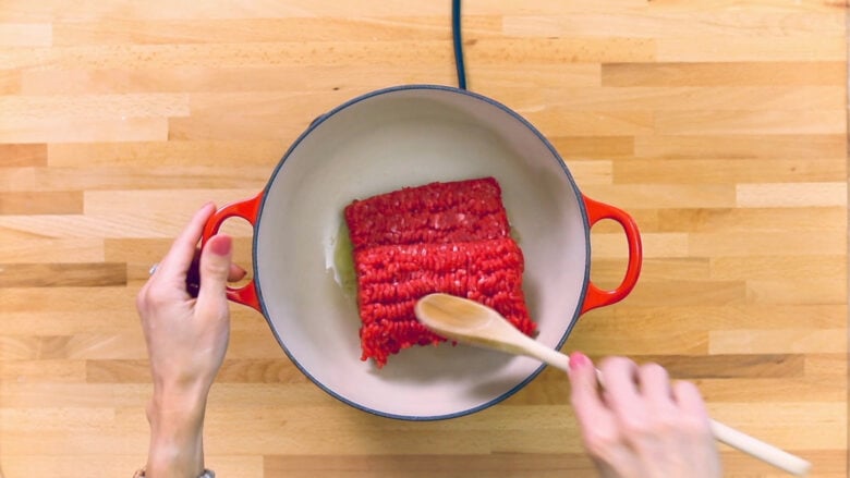 Browning meat in pan for easy ravioli bake