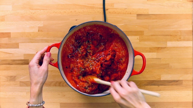 read meat sauce in pan for baked ravioli casserole.