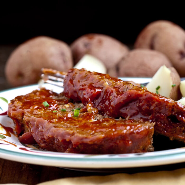 two slices of juicy meatloaf on a plate