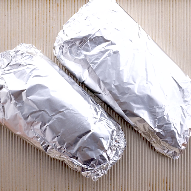 Foil-wrapped ribs ready to be baked in the oven.