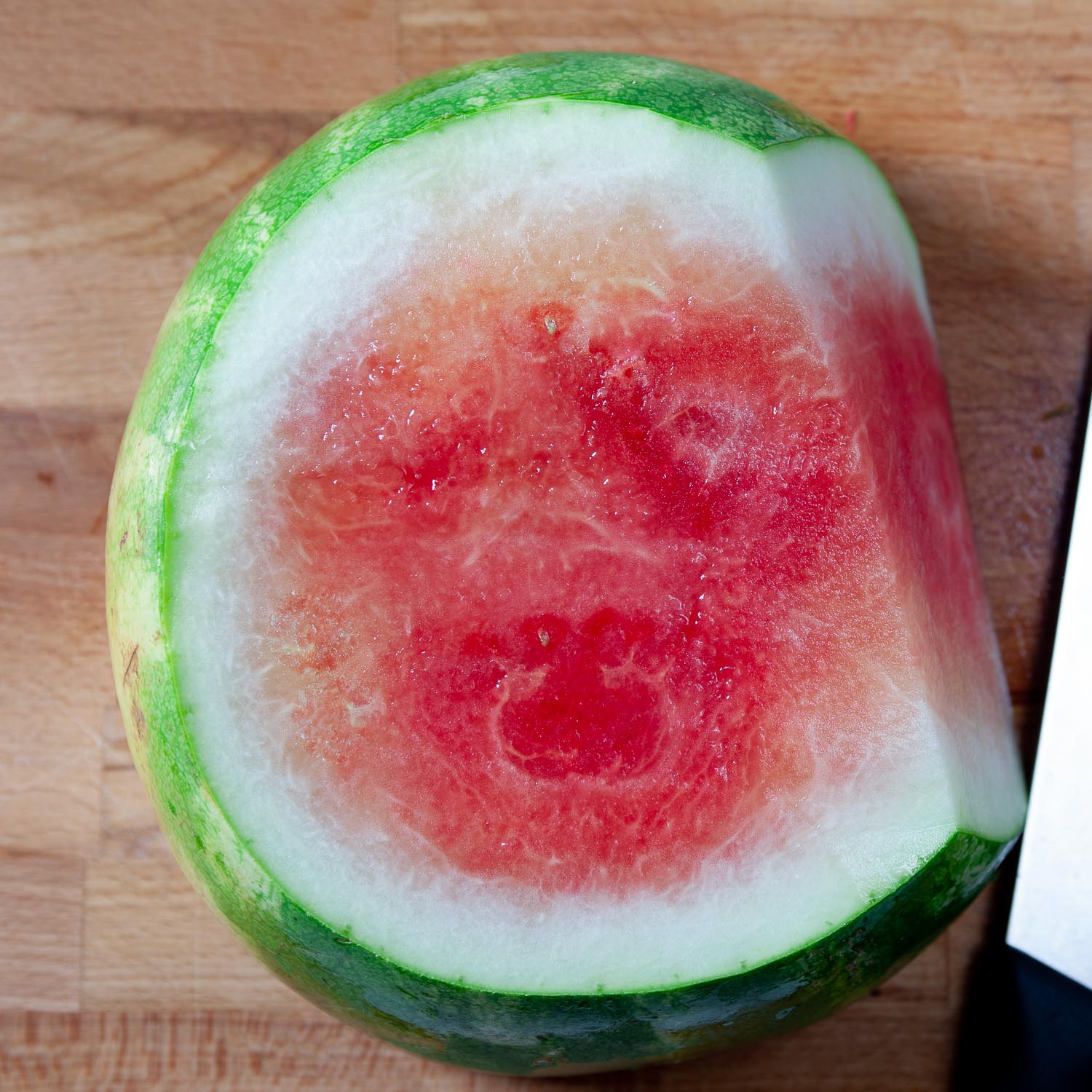 watermelon being cut