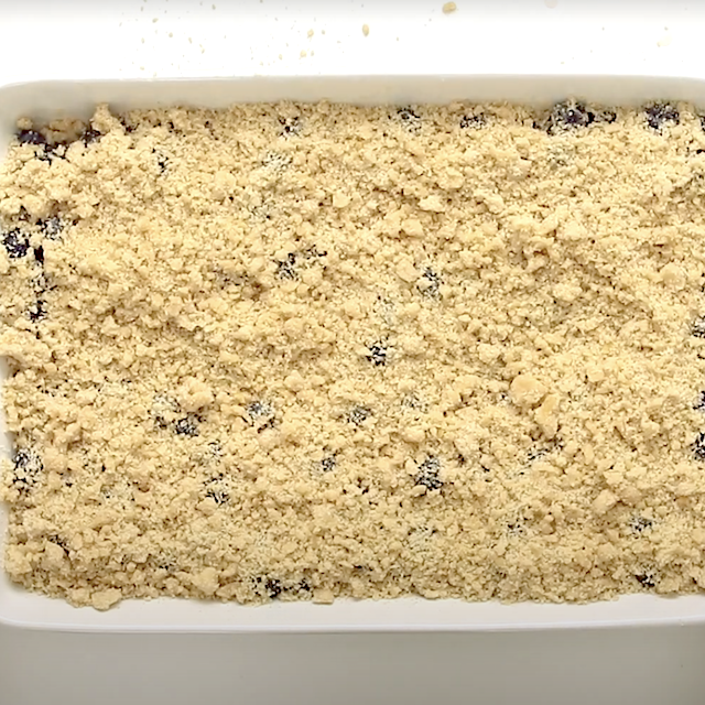 Crumb topping layered on top to make blueberry crumb bars.
