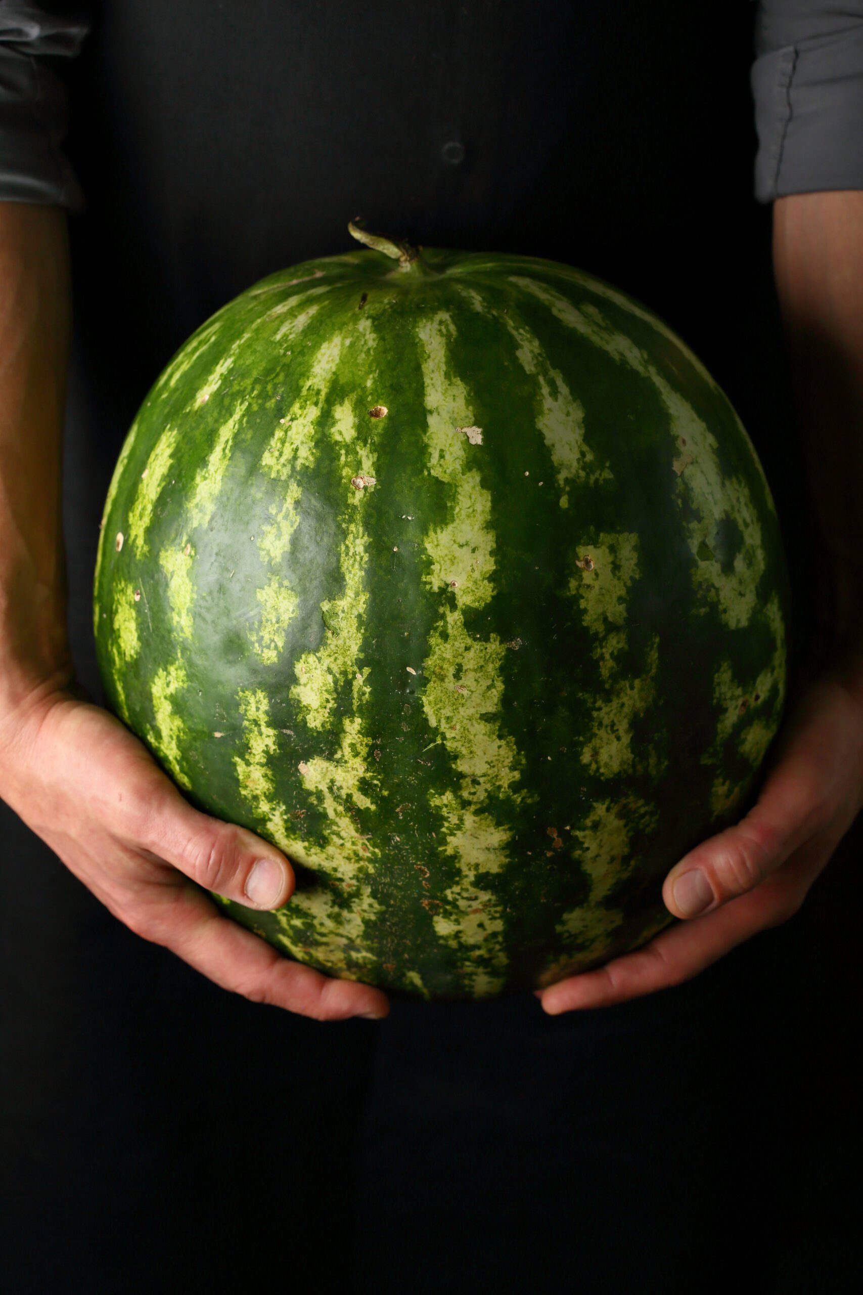 watermelon being held up