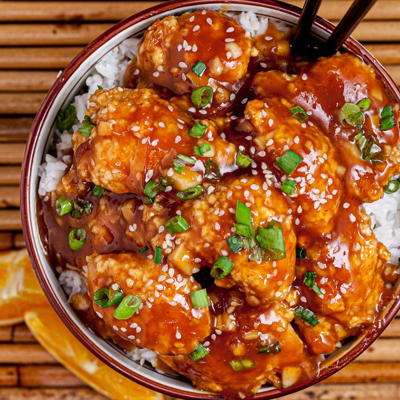 orange chicken in a bowl with rice