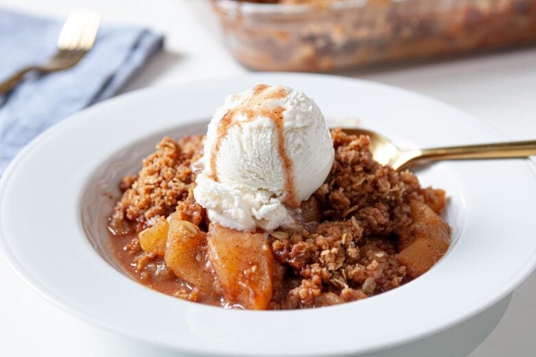 Gluten Free Apple Crisp on a plate with ice cream