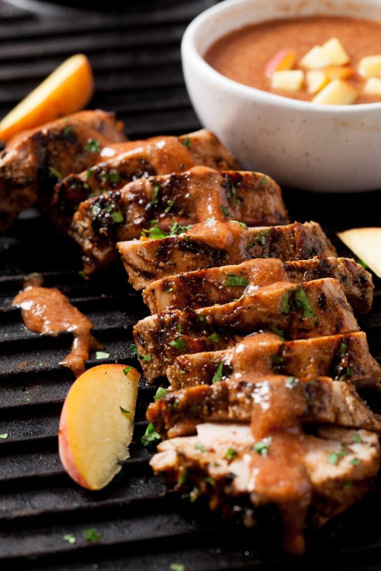 sliced grilled pork tenderloin drizzled with peach bbq sauce