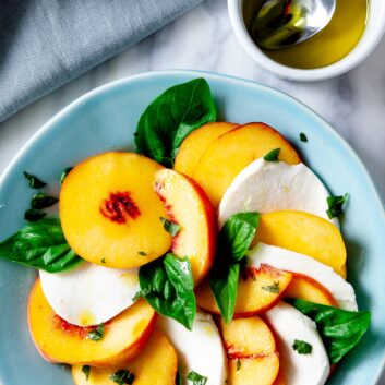 Peach Caprese Salad with peaches and mozzarella and basil.