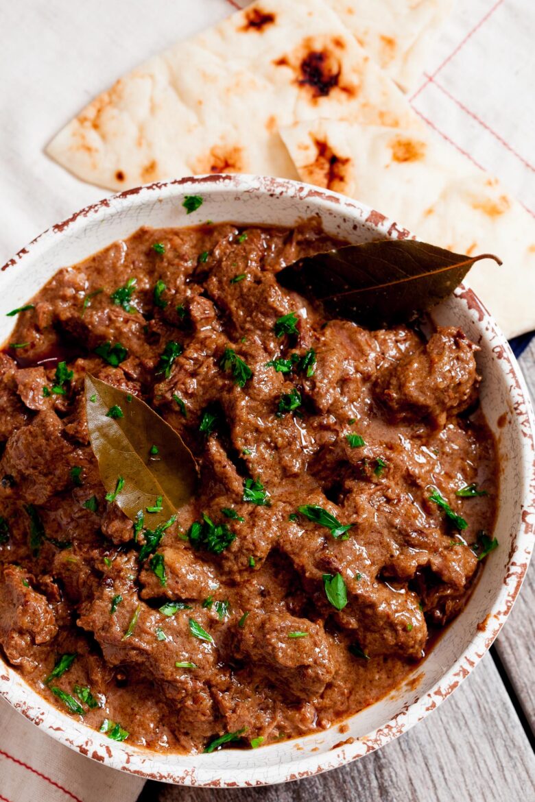 Rogan Josh in a bowl with naan bread