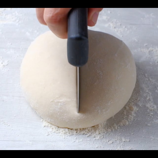dough for scallion pancakes being divided.