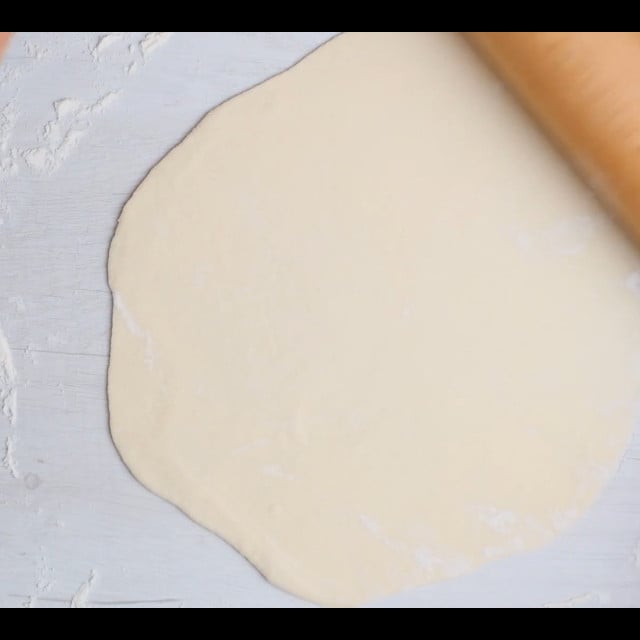 dough rolled out for scallion pancakes.