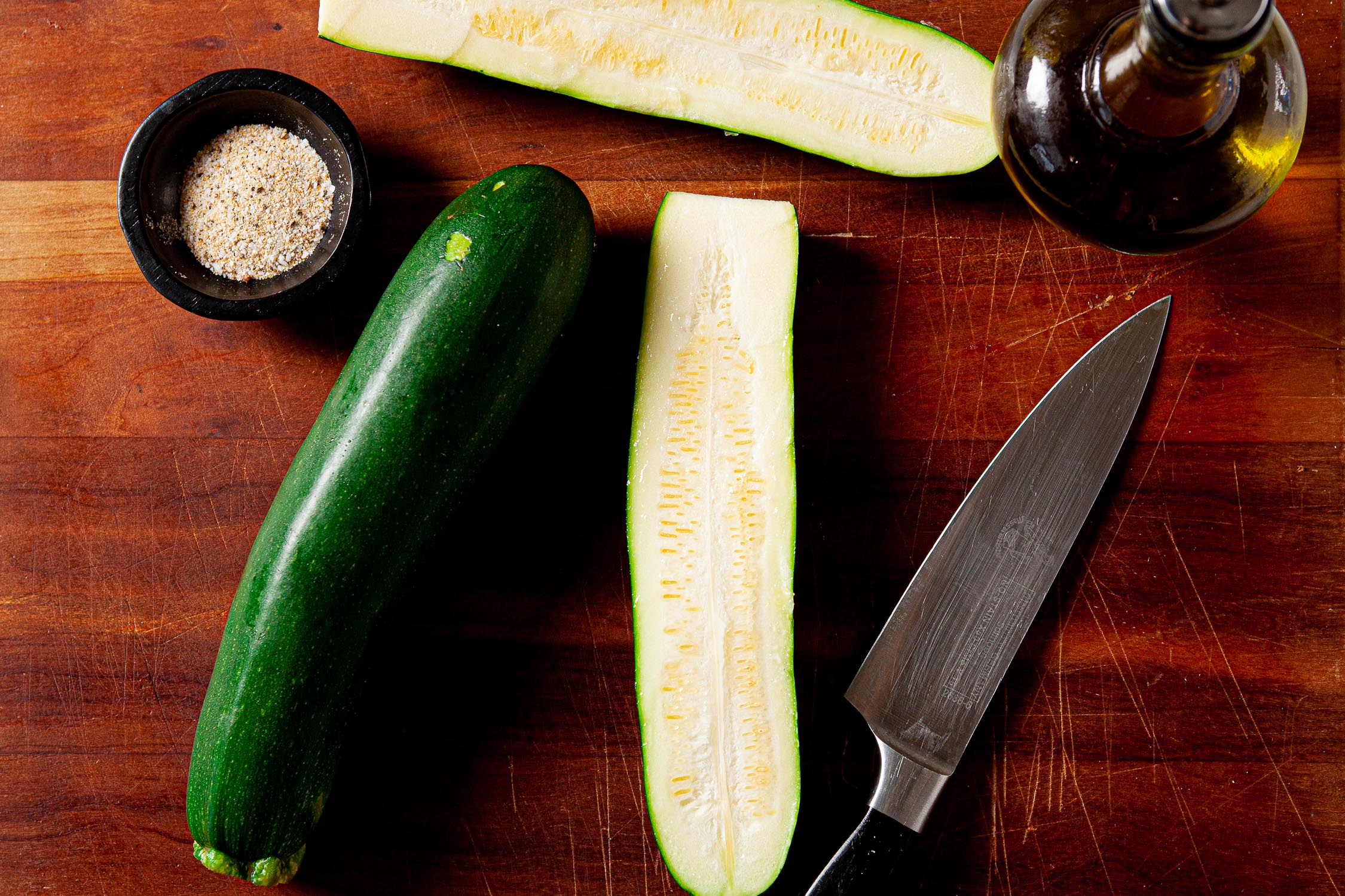 Image of Black zucchini squash on cutting board