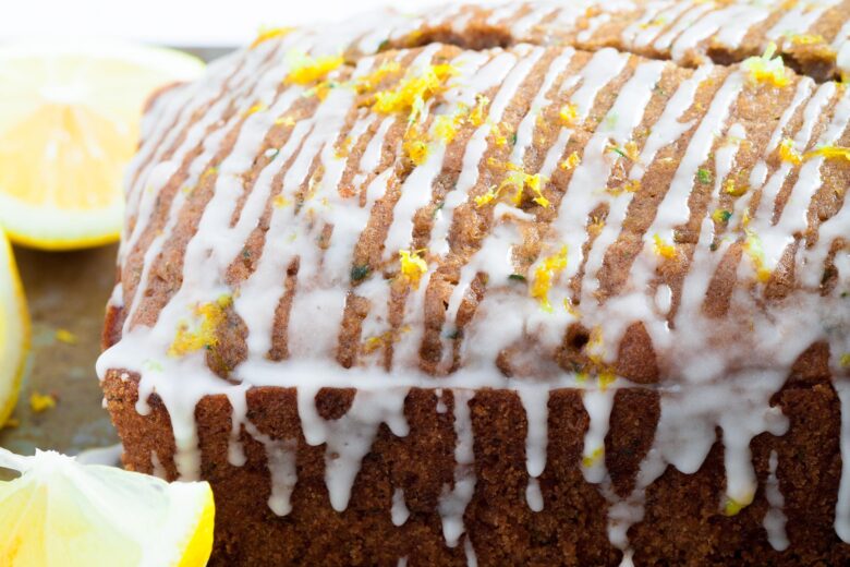 lemon zucchini bread loaf with icing and lemon zest