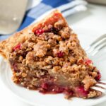 Dutch Apple Pie on a white plate with forks