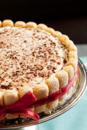 a tiramisu cake dusted with chocolate shavings on top