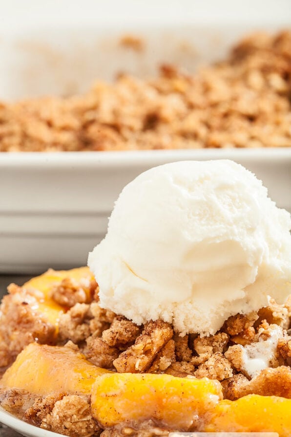 peach crisp with vanilla ice cream