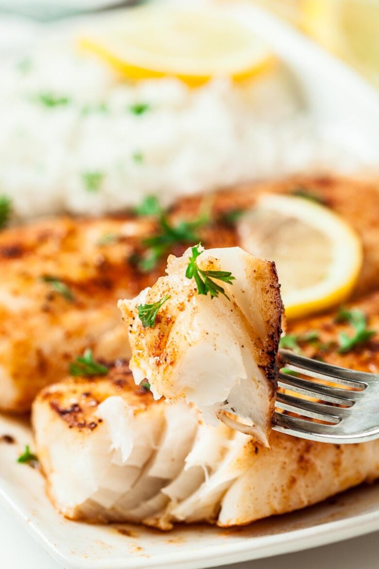 Lemon Butter Fish on white plate with fork