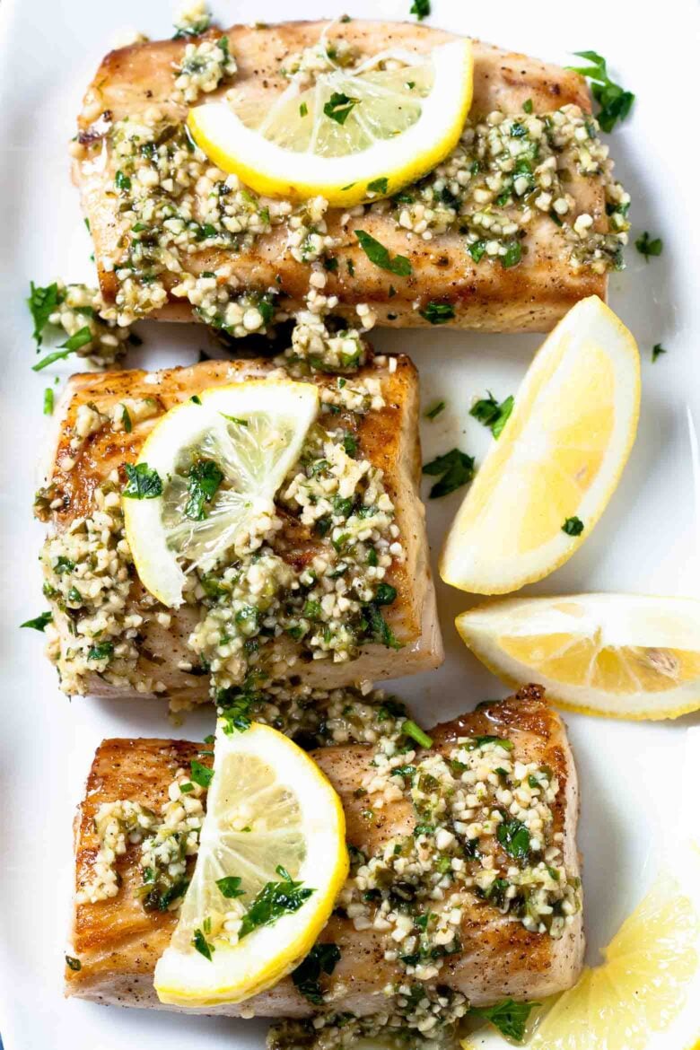 Mahi Mahi Fillets with Lemon on Plate.