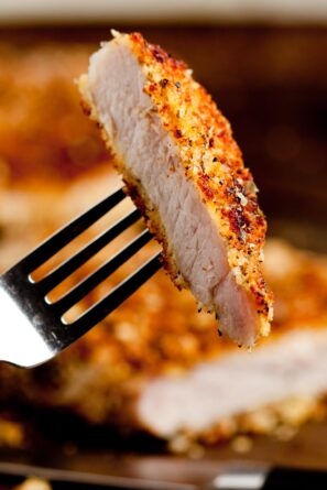 a piece of panko breaded pork chop on a fork