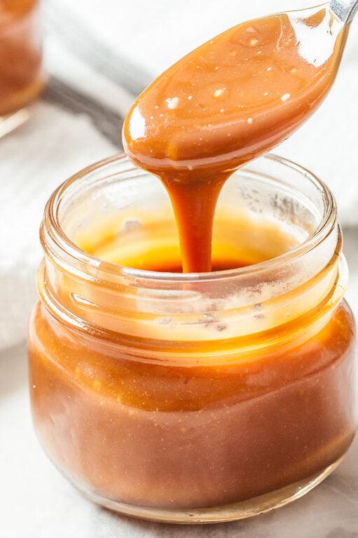 Salted Caramel Sauce in a jar with spoon
