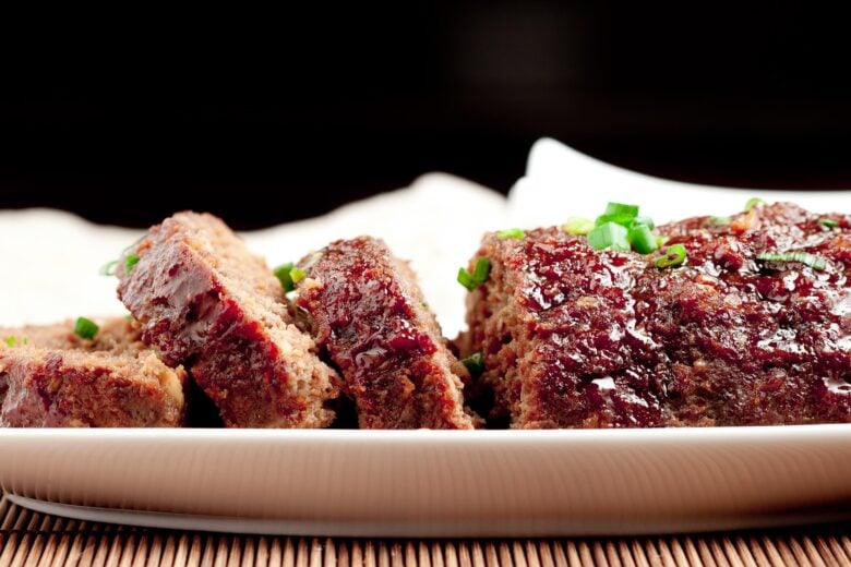 sliced teriyaki meatloaf on a white platter