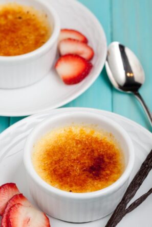 creme brulee in ramekins with strawberries
