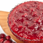 a bowl of homemade cranberry sauce with fresh cranberries