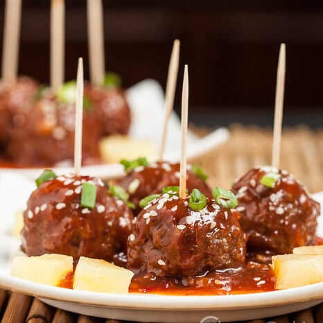 sweet and sour meatballs with pineapples and sesame seeds