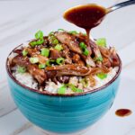 Slow Cooker Teriyaki Chicken over rice in a bowl