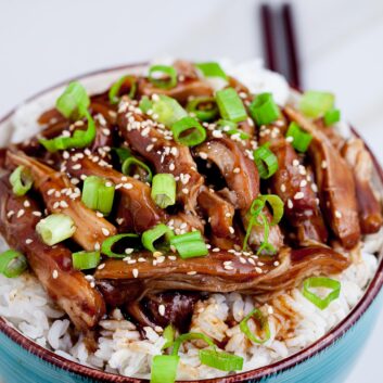 Slow Cooker Teriyaki Chicken over rice in a bowl