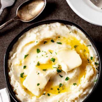 instant pot mashed potatoes with butter in bowl.