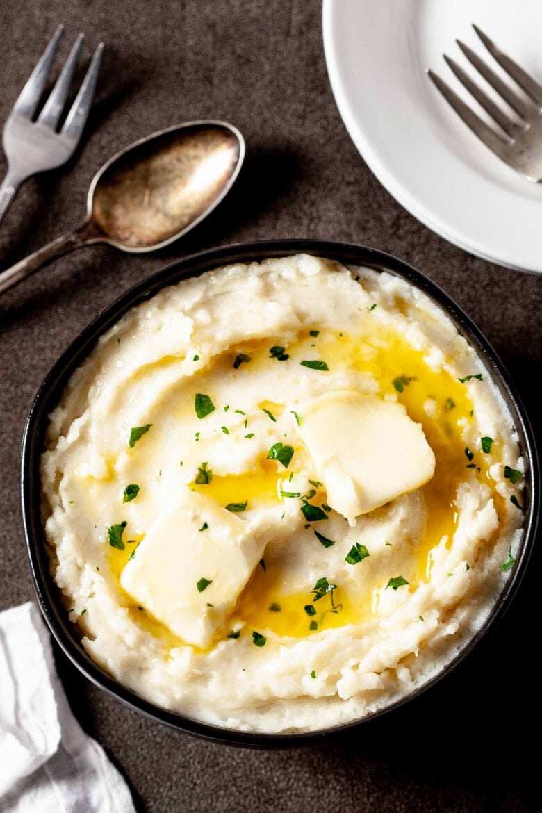 instant pot mashed potatoes with butter in bowl.