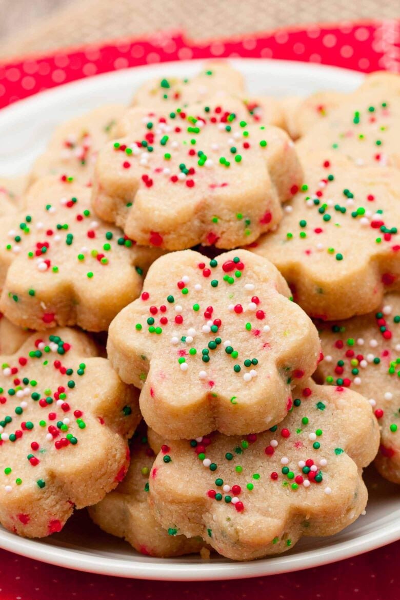 shortbread cookies cut into shapes with colorful sprinkles. 