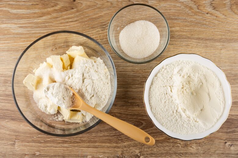 butter, flour, and sugar in bowls.