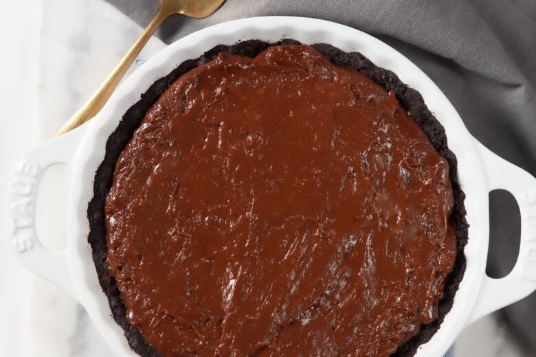 chocolate pie filling ingredients in a pot being stirred