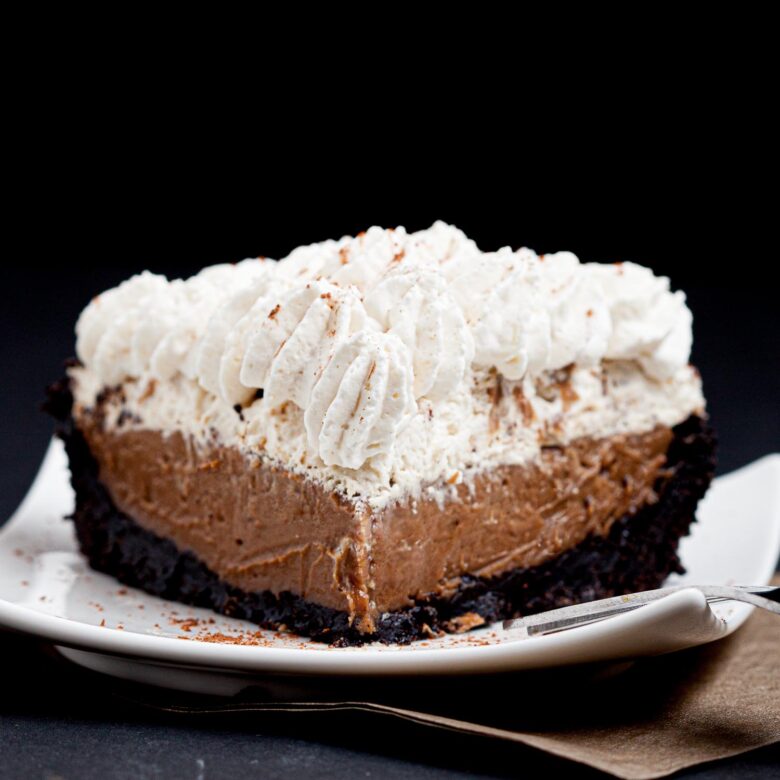 chocolate pie slice with whipped cream on a plate