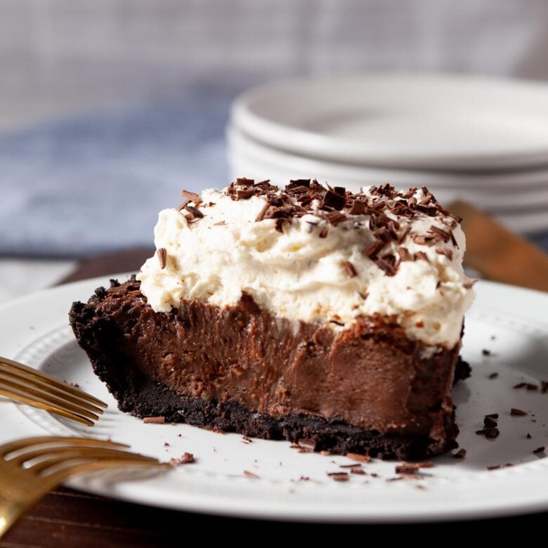 chocolate pie slice on a plate with forks